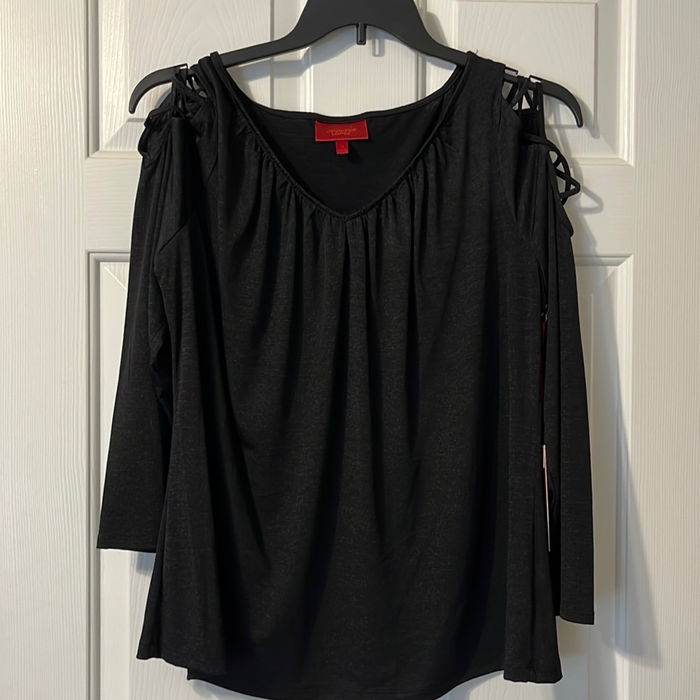 Jennifer Lopez black blouse with lattice sleeves